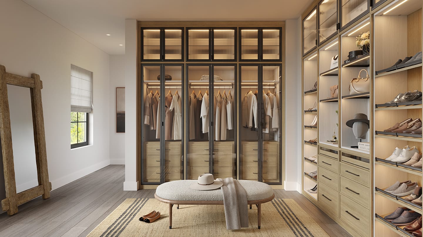 Wardrobe closet with custom cabinets and drawers by California Closets