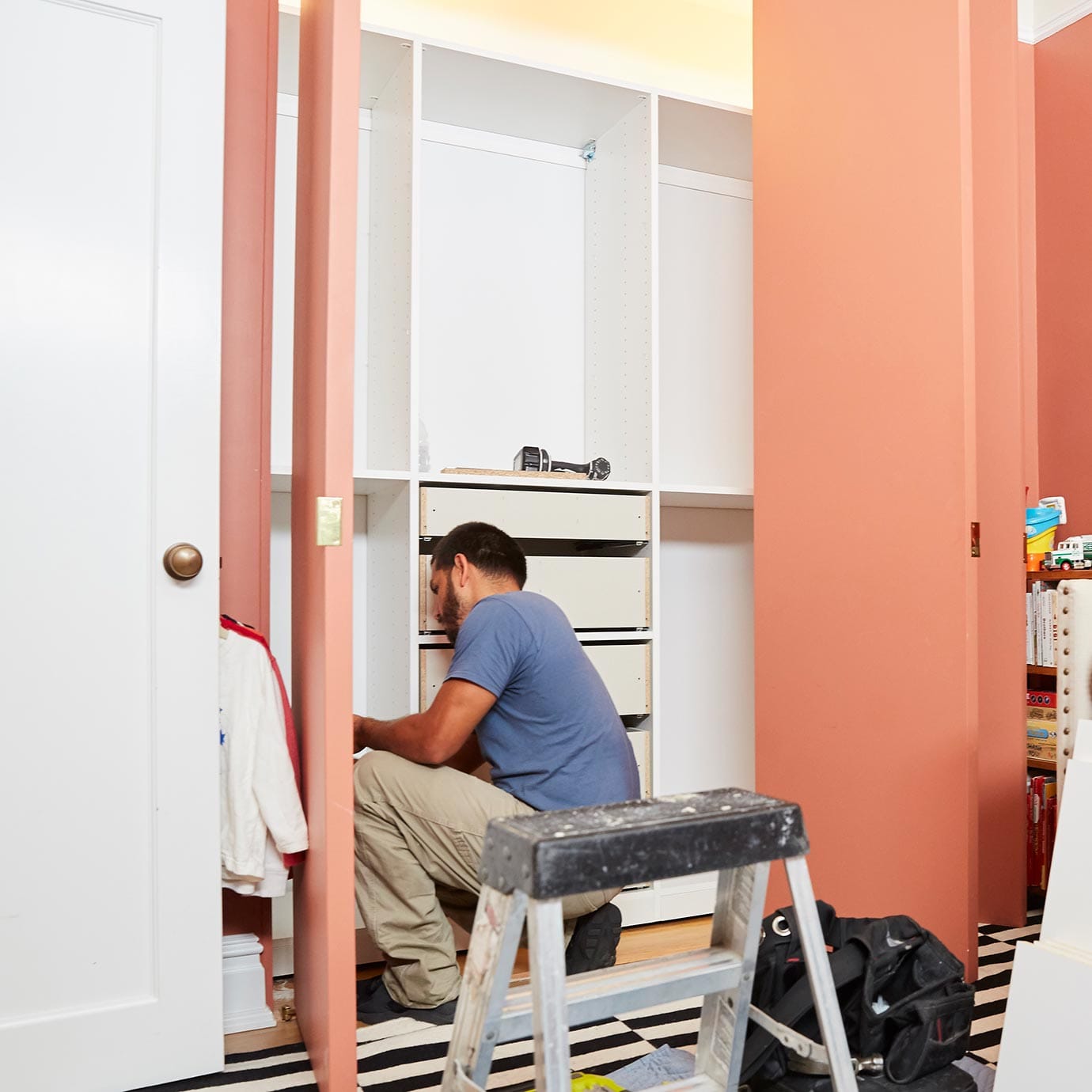 Professional installation job with built in drawers in process by California Closets